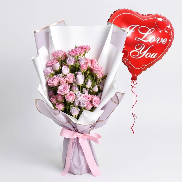 باقة أنيقة من الورود البنفسجية والوردية