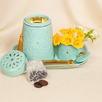 مجموعة هدايا فاخرة من البخور مع زهور صفراء ومبخرة بورسلين