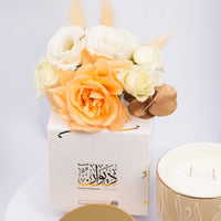 أوتانتيك هوم - شمعة روز مارين الفاخرة مع ورود بيضاء وبرتقالية أنيقة