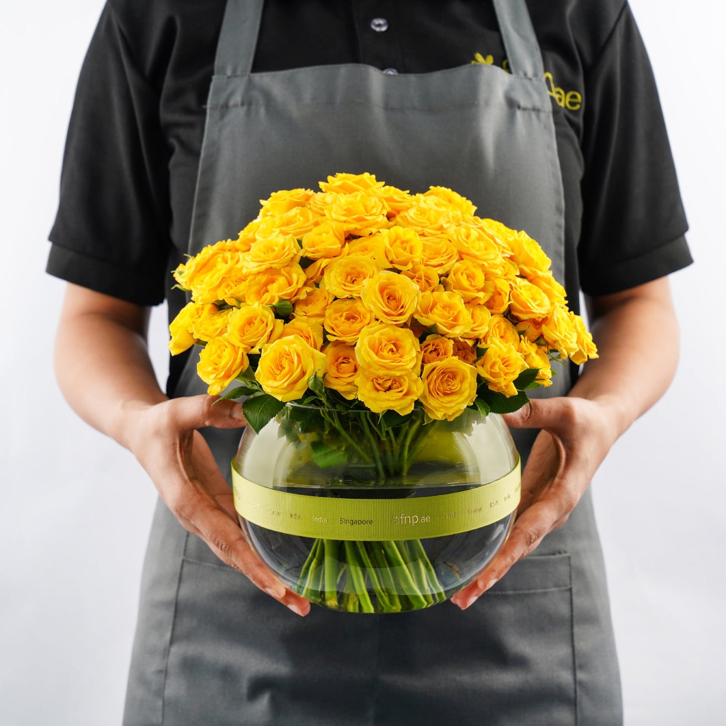 Elegant Arrangement of 15 Yellow Spray Roses in a Fish Bowl Vase