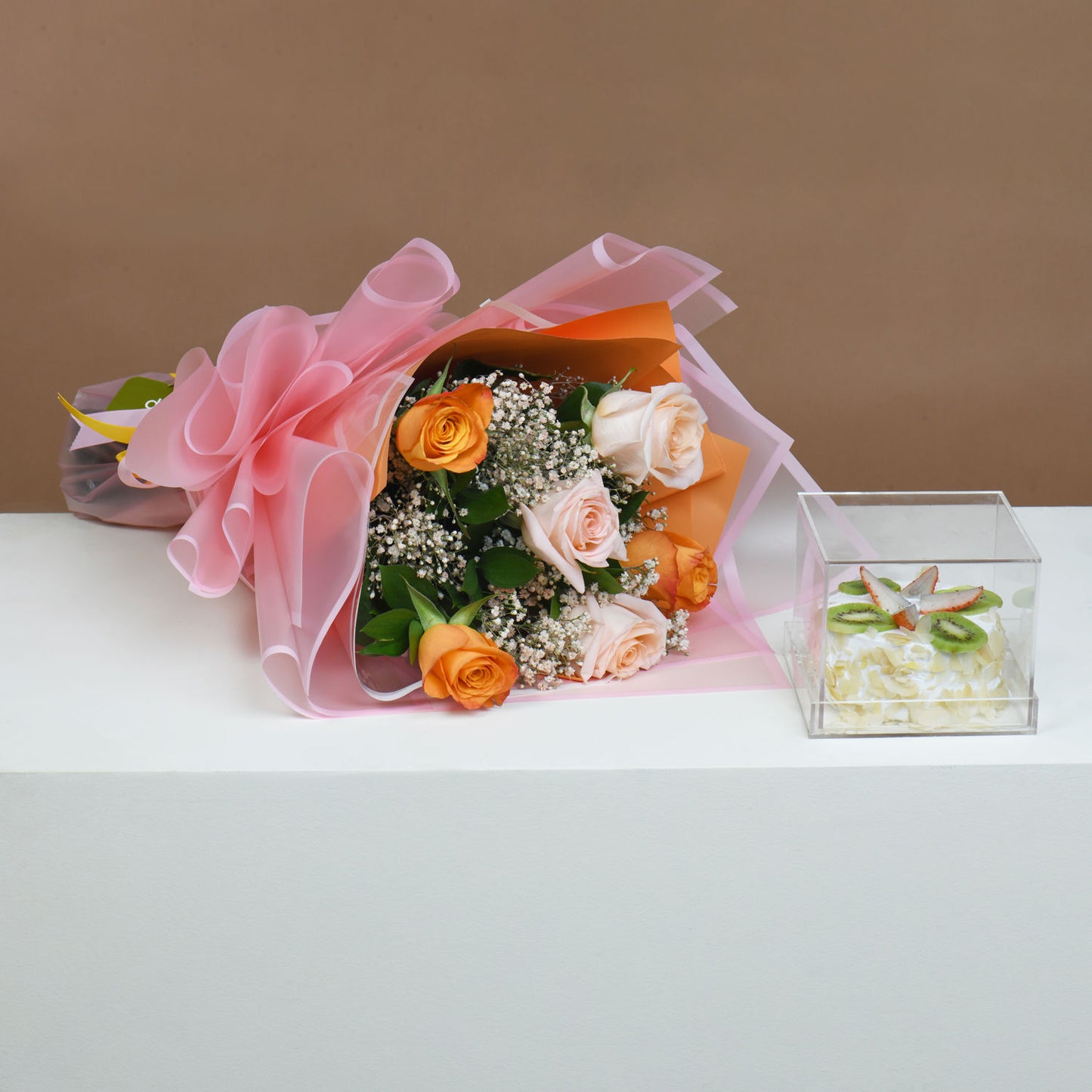 Elegant Bouquet of Orange and Peach Roses with Delightful Fruit Cake