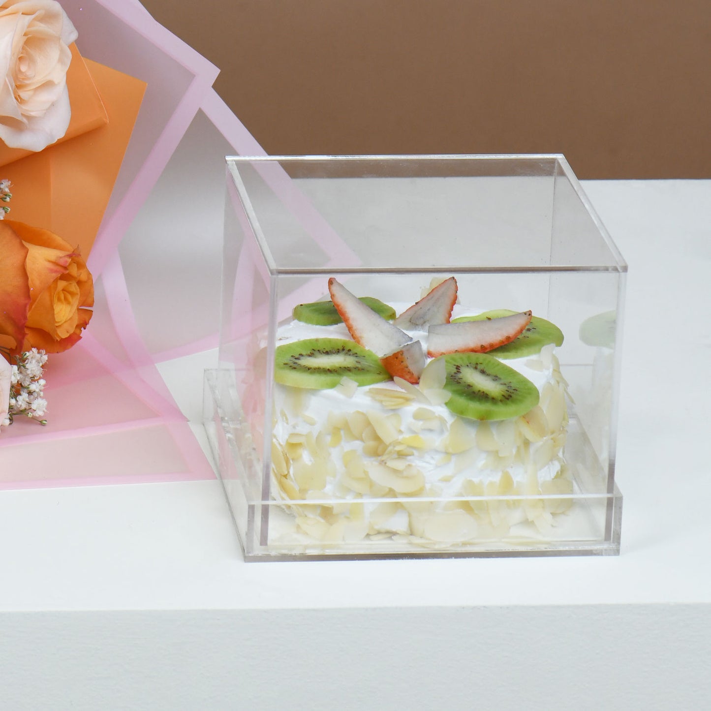 Elegant Bouquet of Orange and Peach Roses with Delightful Fruit Cake
