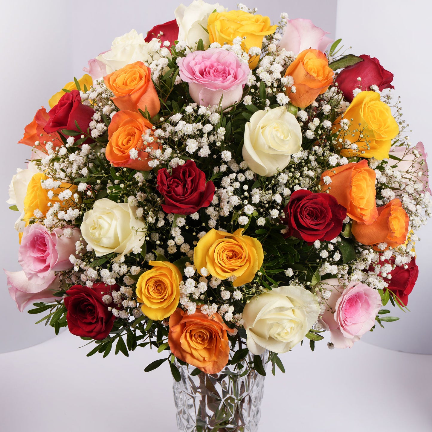 Elegant Bouquet of 50 Assorted Roses in a Stylish Glass Vase