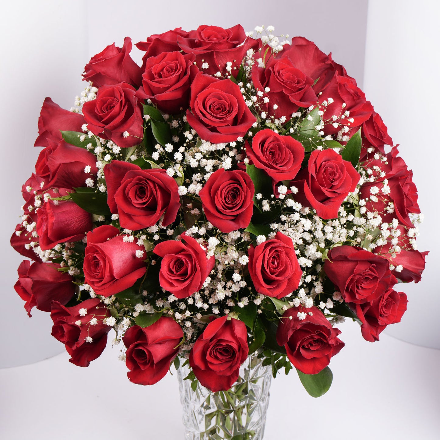 Luxurious Bouquet of 50 Scarlet Red Roses with Elegant Fillers in a Glass Vase