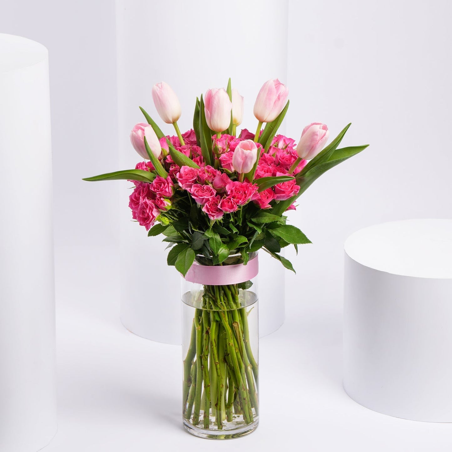 Charming Bouquet of Pink Tulips & Baby Roses in Elegant Glass Vase
