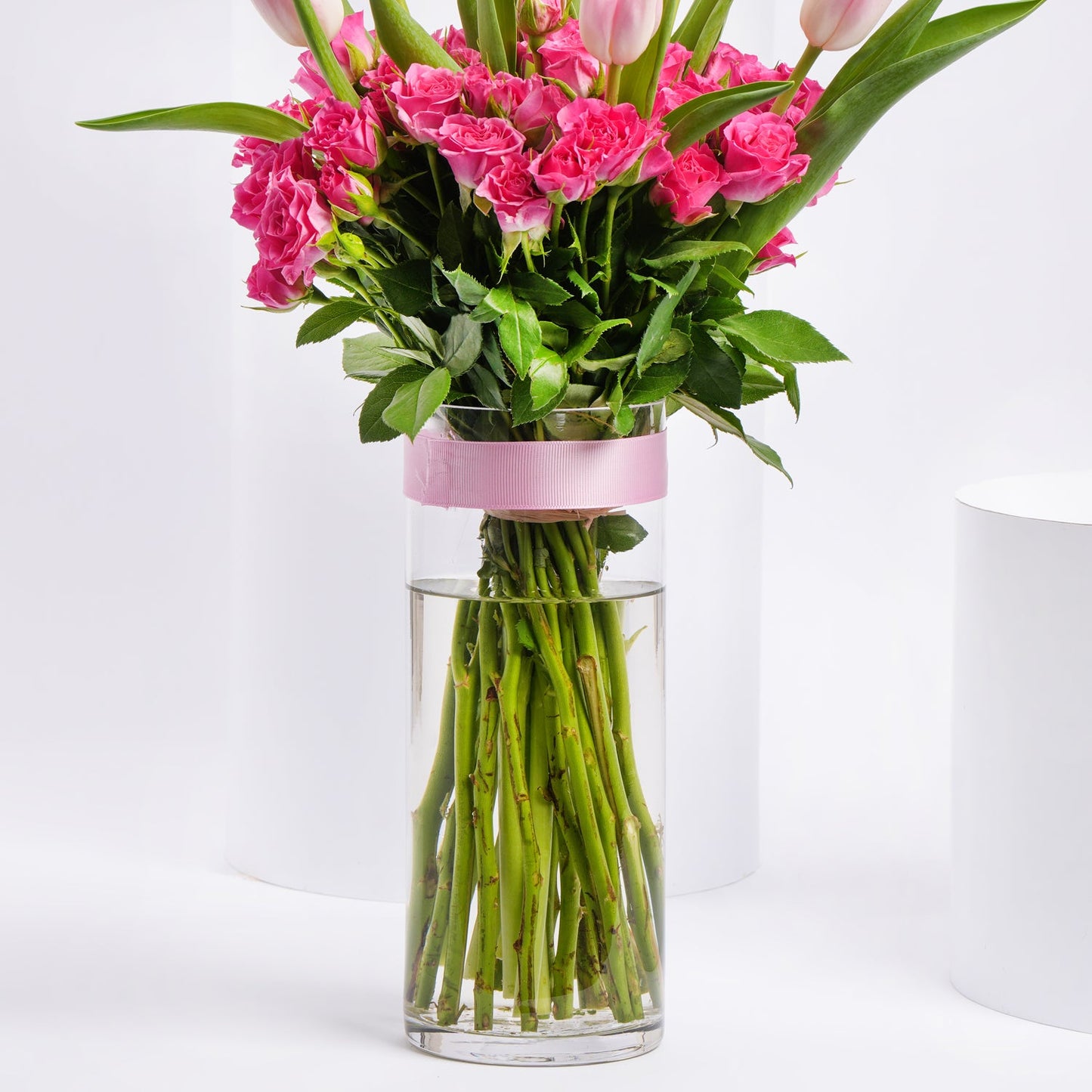 Charming Bouquet of Pink Tulips & Baby Roses in Elegant Glass Vase