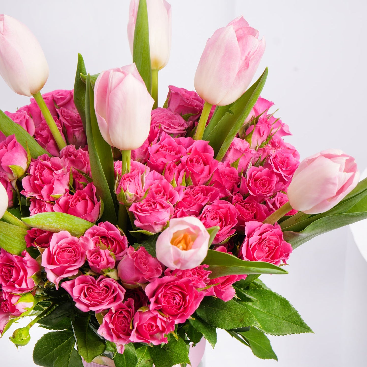 Charming Bouquet of Pink Tulips & Baby Roses in Elegant Glass Vase