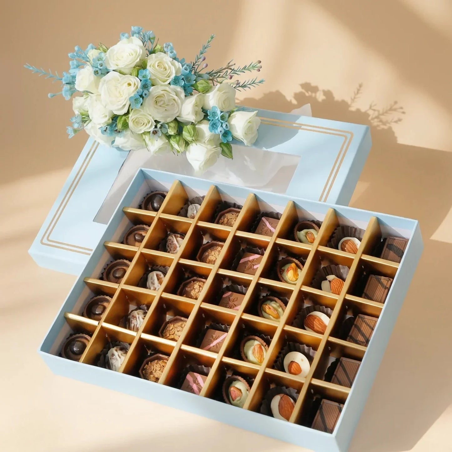 Empire Chocolate: Luxurious Baby Blue Gift Box with 35 Assorted Chocolates & Elegant White Rose Bouquet