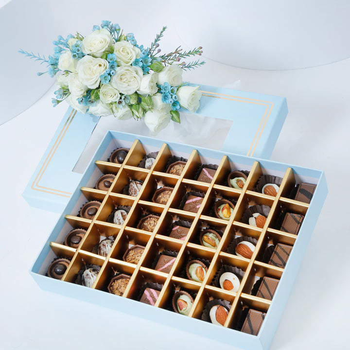 Empire Chocolate: Luxurious Baby Blue Gift Box with 35 Assorted Chocolates & Elegant White Rose Bouquet