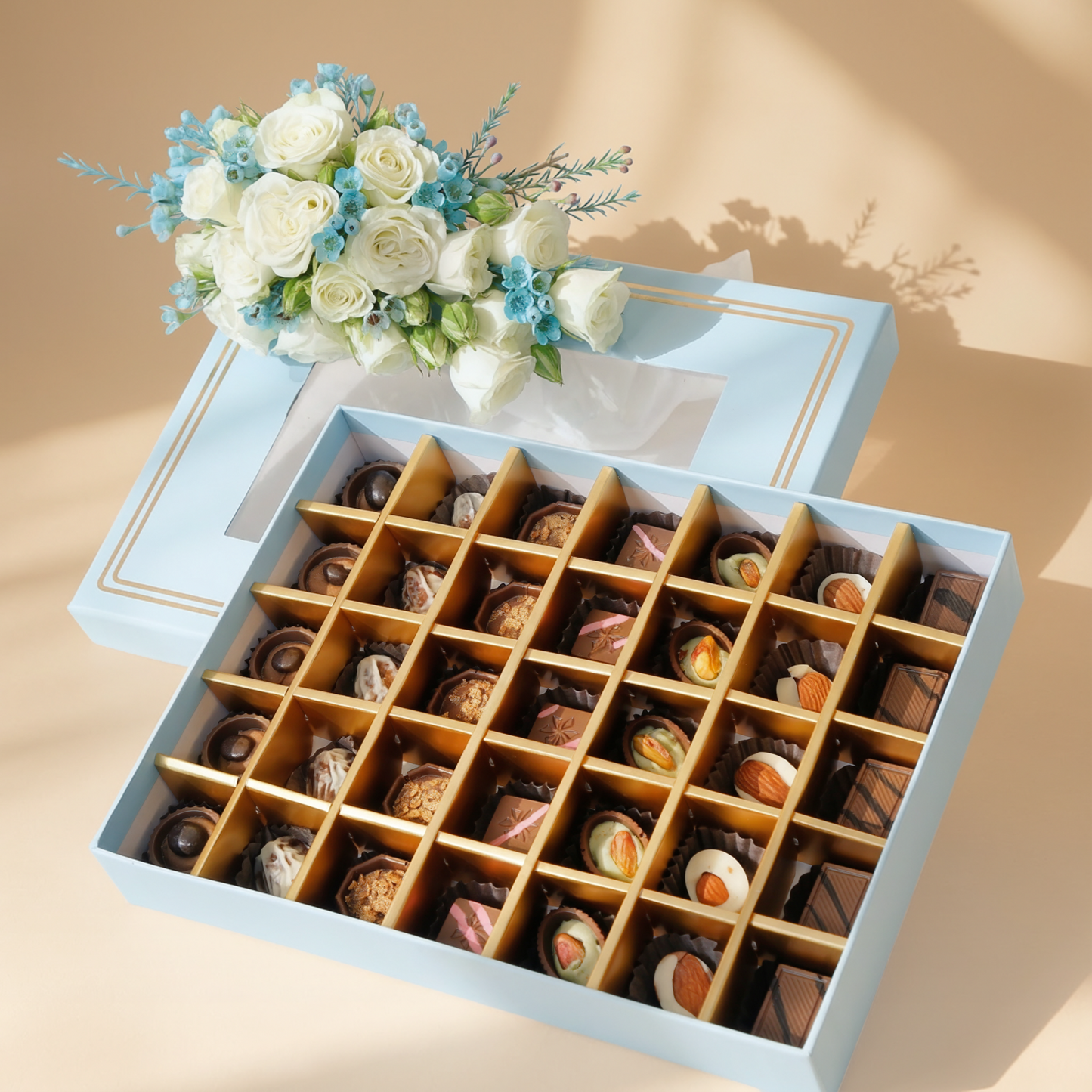 Empire Chocolate: Luxurious Baby Blue Gift Box with 35 Assorted Chocolates & Elegant White Rose Bouquet