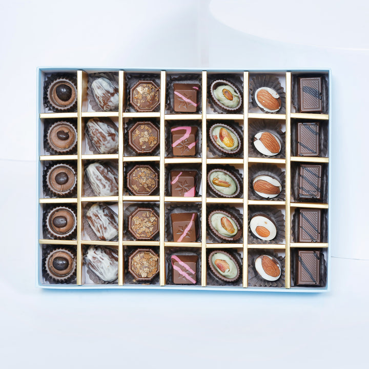 Empire Chocolate: Luxurious Baby Blue Gift Box with 35 Assorted Chocolates & Elegant White Rose Bouquet