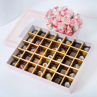 شوكولاتة إمباير: علبة شوكولاتة وردية فاخرة تحتوي على 35 قطعة مختارة و باقة ورود أنيقة