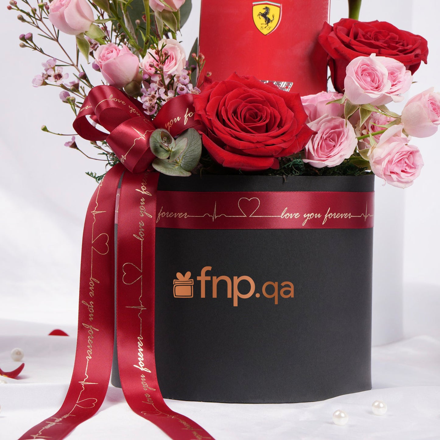 Elegant Ferrari Red Perfume Gift Set with Luxurious Floral Arrangement