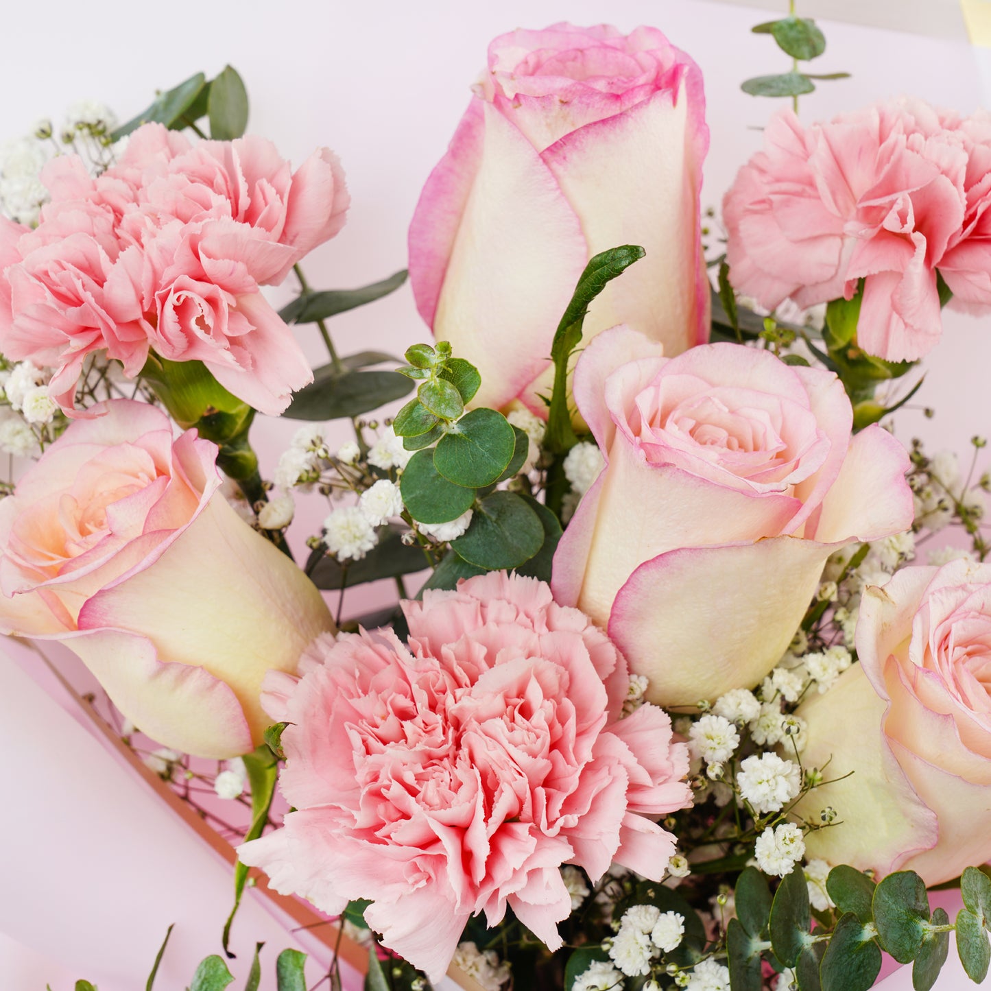 Elegant Floral Tribute: Pink Roses and Carnations Bouquet
