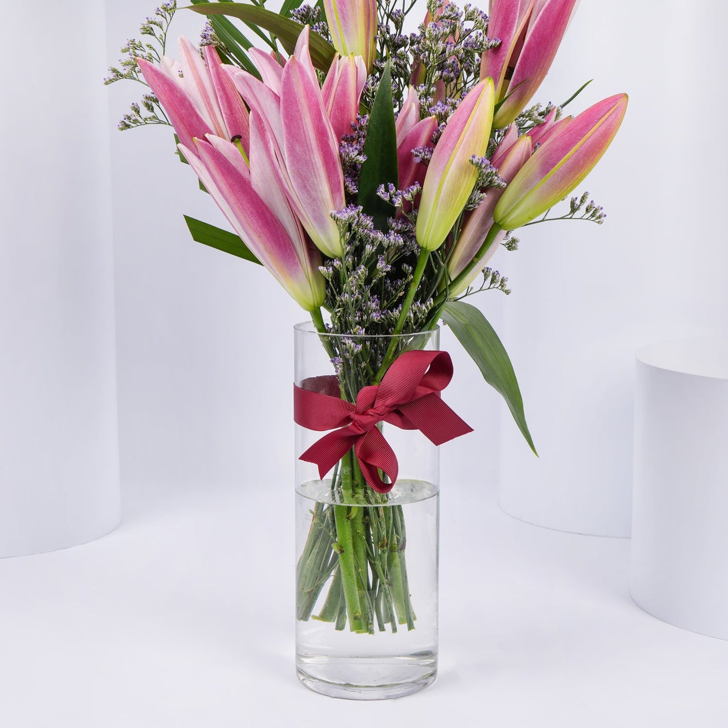 Elegant Grand Pink Petals Arrangement in Glass Vase
