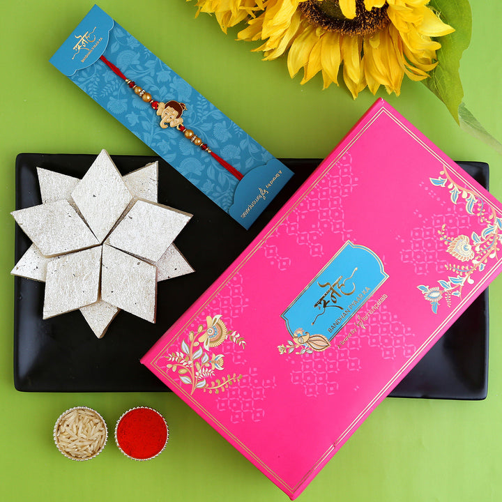 Charming Long Trunk Bal Ganesha Pearl Rakhi for Kids with 340g Kaju Katli - Perfect Festive Gift
