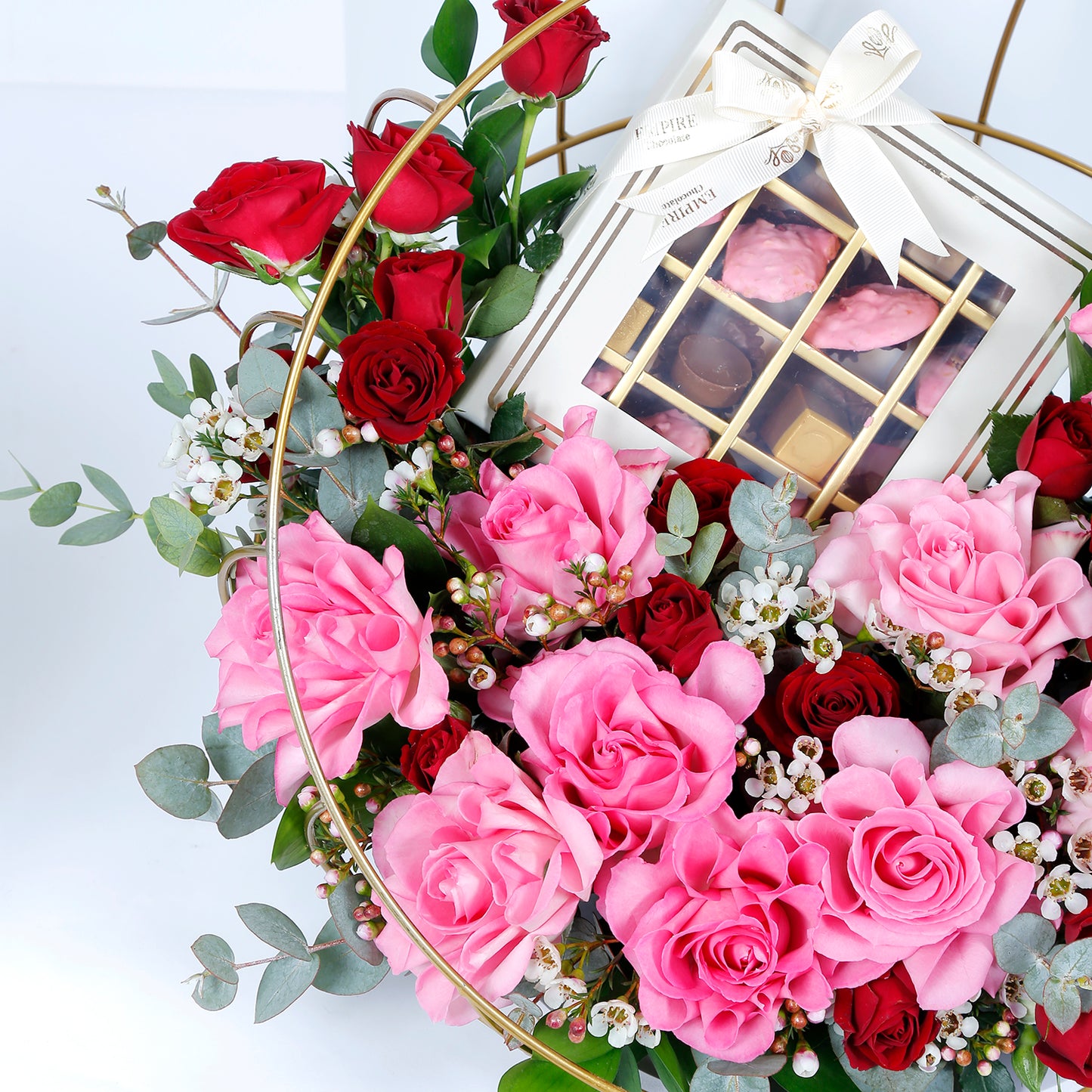 Elegant Metal Stand Arrangement with Mixed Flowers and Gourmet Chocolates