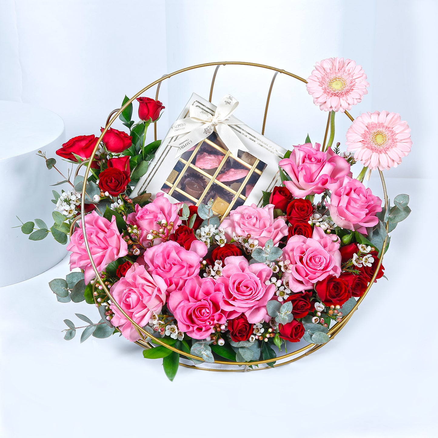Elegant Metal Stand Arrangement with Mixed Flowers and Gourmet Chocolates