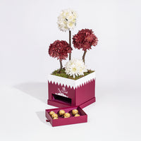 تنسيق زهور الأقحوان الأنيق لليوم الوطني مع شوكولاتة