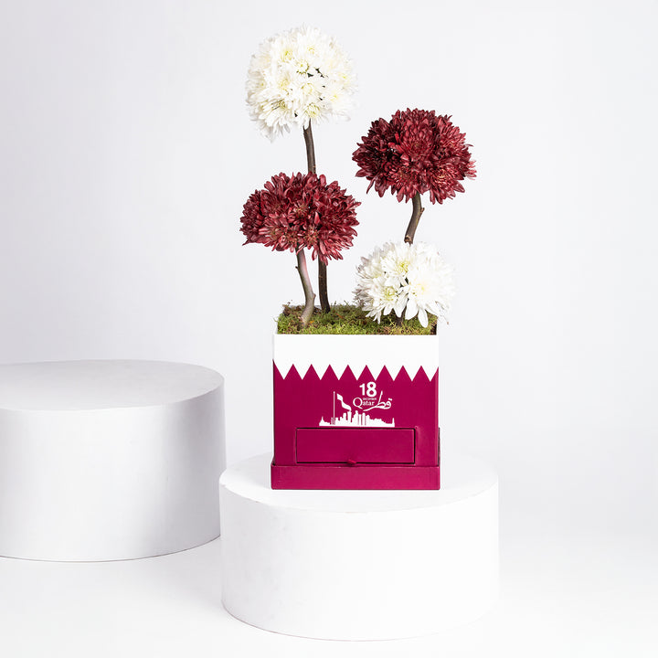 تنسيق زهور الأقحوان الأنيق لليوم الوطني مع شوكولاتة