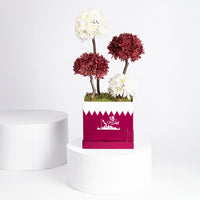 تنسيق زهور الأقحوان الأنيق لليوم الوطني مع شوكولاتة