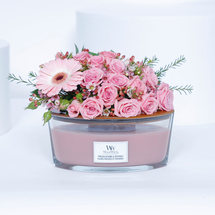 WoodWick Ellipse Candle - Pressed Blooms & Patchouli with Elegant Floral Arrangement