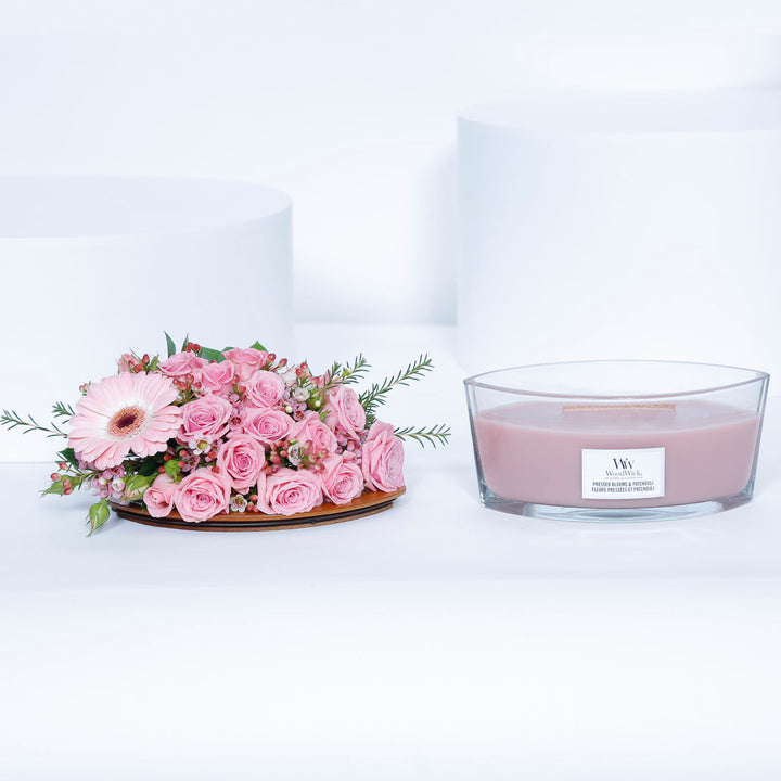 WoodWick Ellipse Candle - Pressed Blooms & Patchouli with Elegant Floral Arrangement