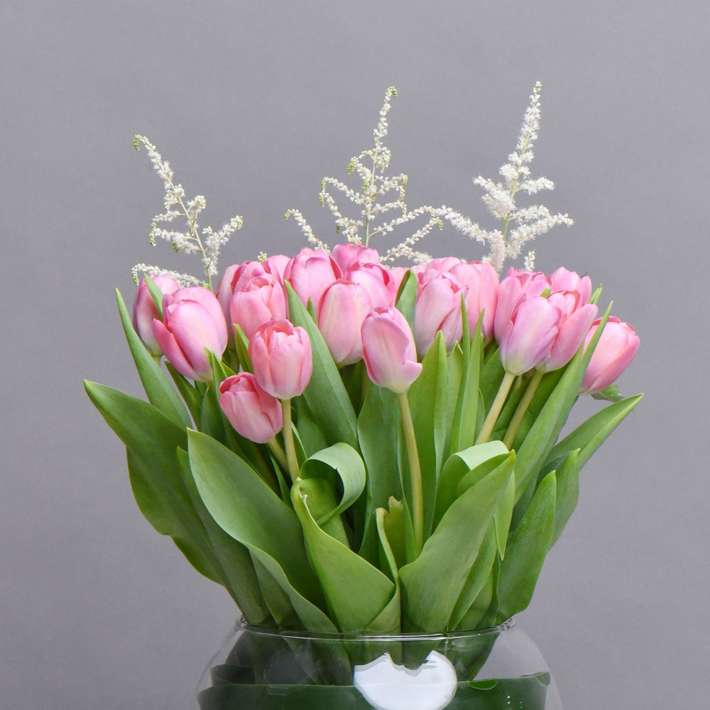 Exquisite Pink Tulips in Fish Bowl Vase