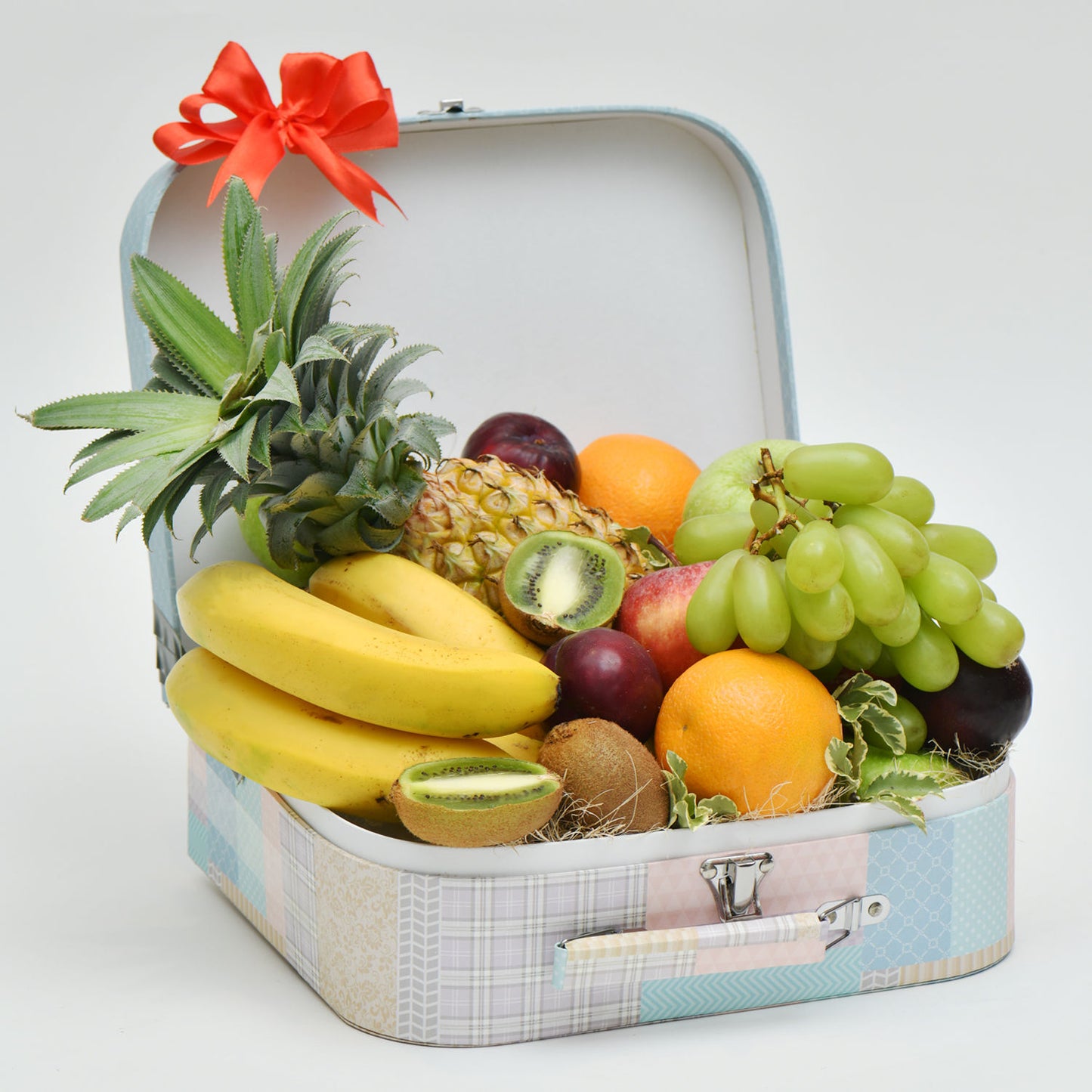 Deluxe Exotic Fruit Hamper in Elegant Floral Suitcase