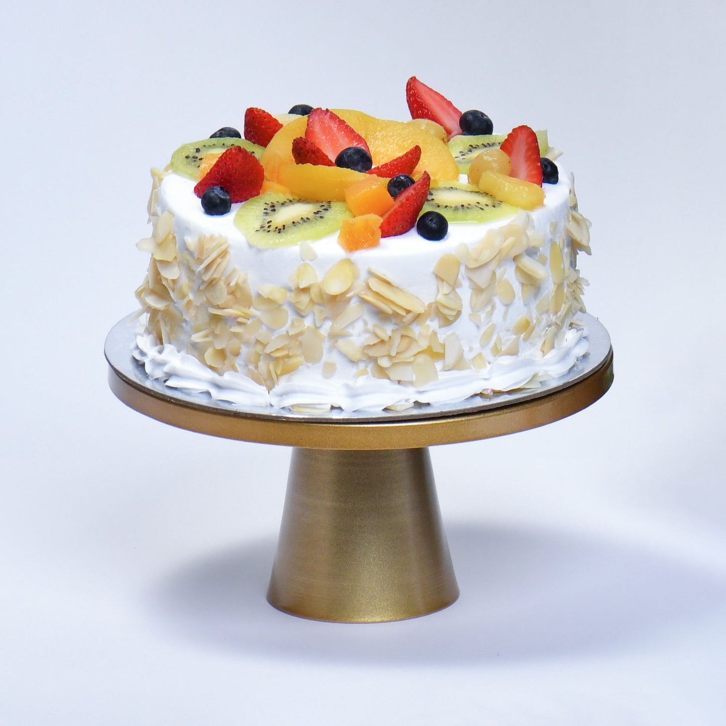 Elegant Flower Trio with Delightful Fresh Fruit Cake