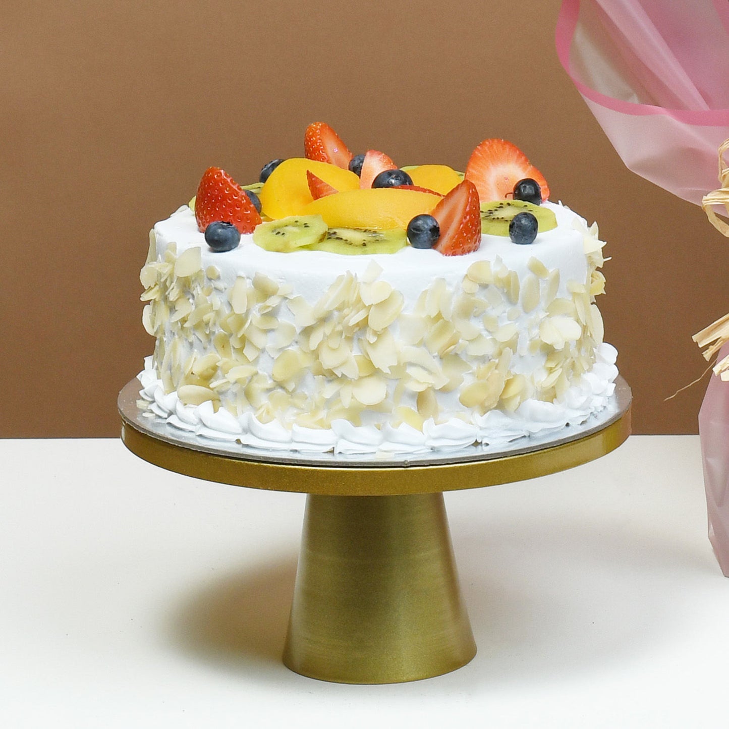 Elegant Bouquet of Blushing Roses with Delectable Fruit Cake