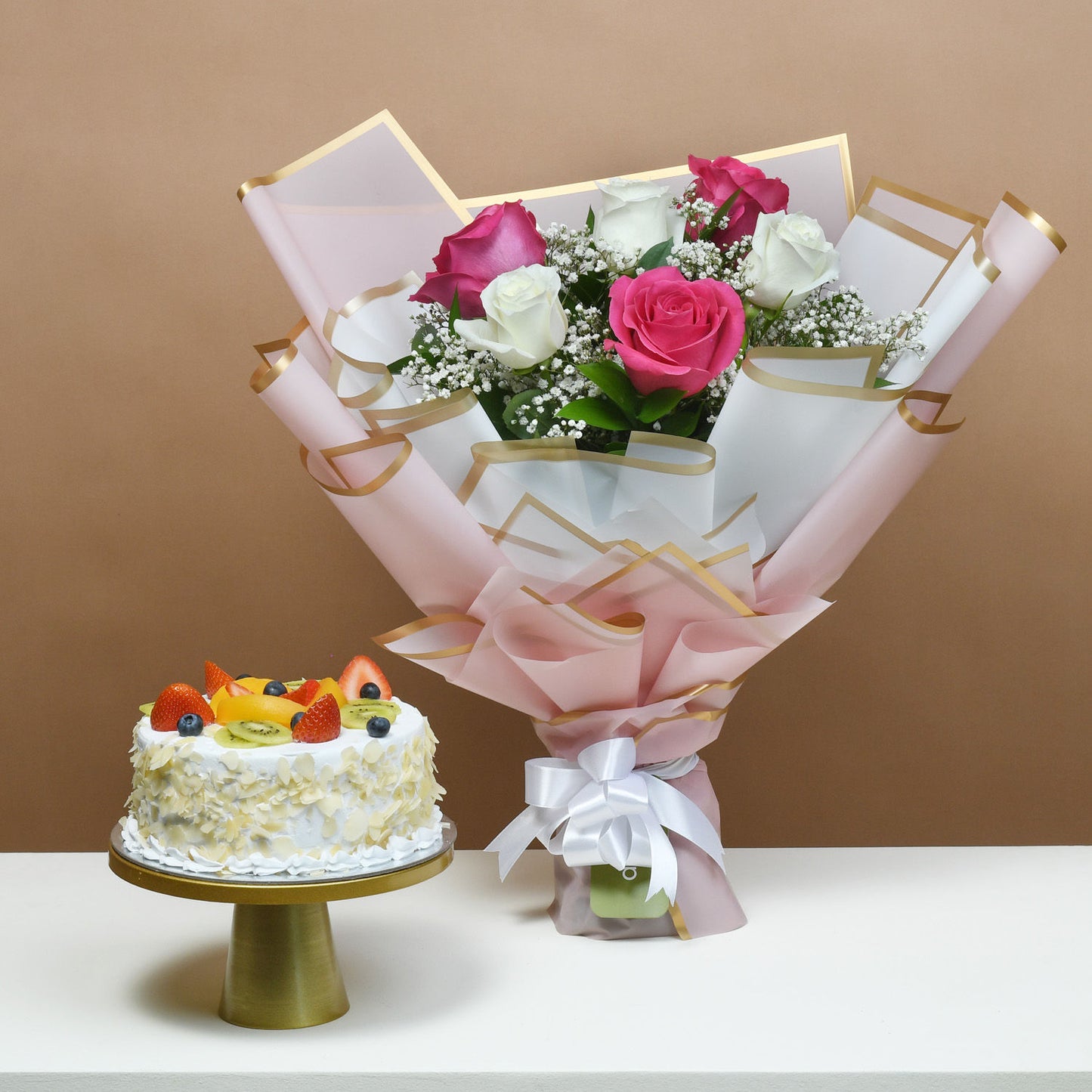 Whispering Love: A Delightful Bouquet and Fresh Fruit Cake Combo
