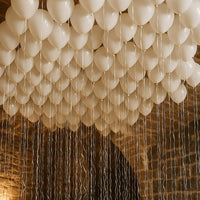 100 White Balloons