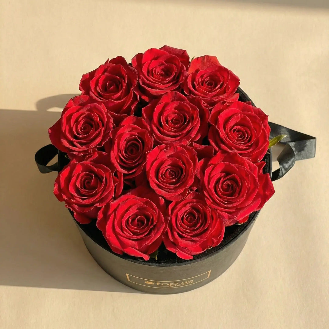 Luxurious 12 Red Roses in Elegant Black Round Box