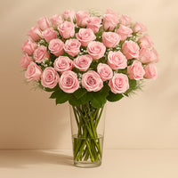 Elegant Bouquet of 50 Stunning Pink Roses with Gypsophila in a Glass Vase