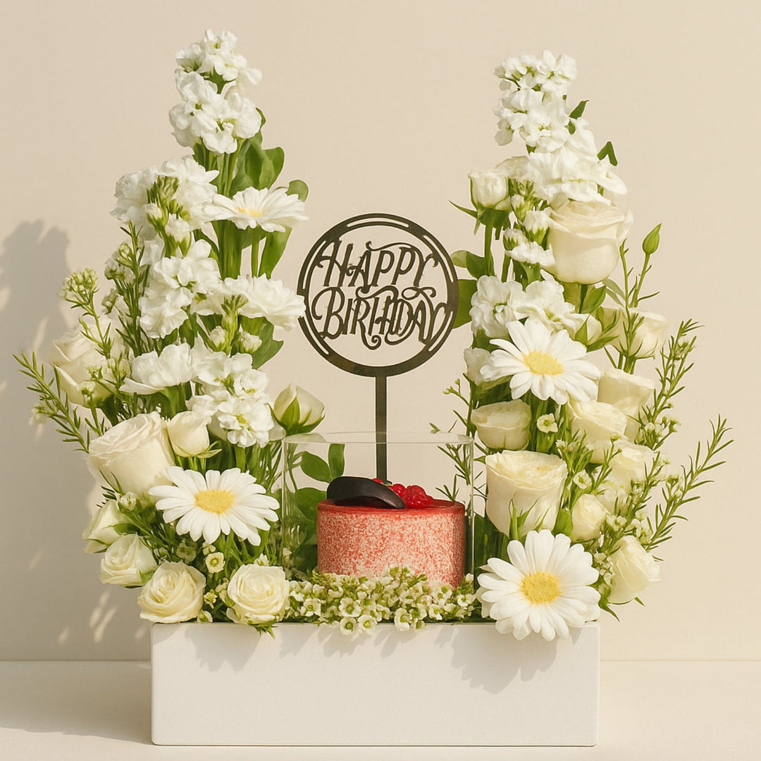 تنسيق زهور عيد ميلاد أنيق مع كيك ريد فيلفيت