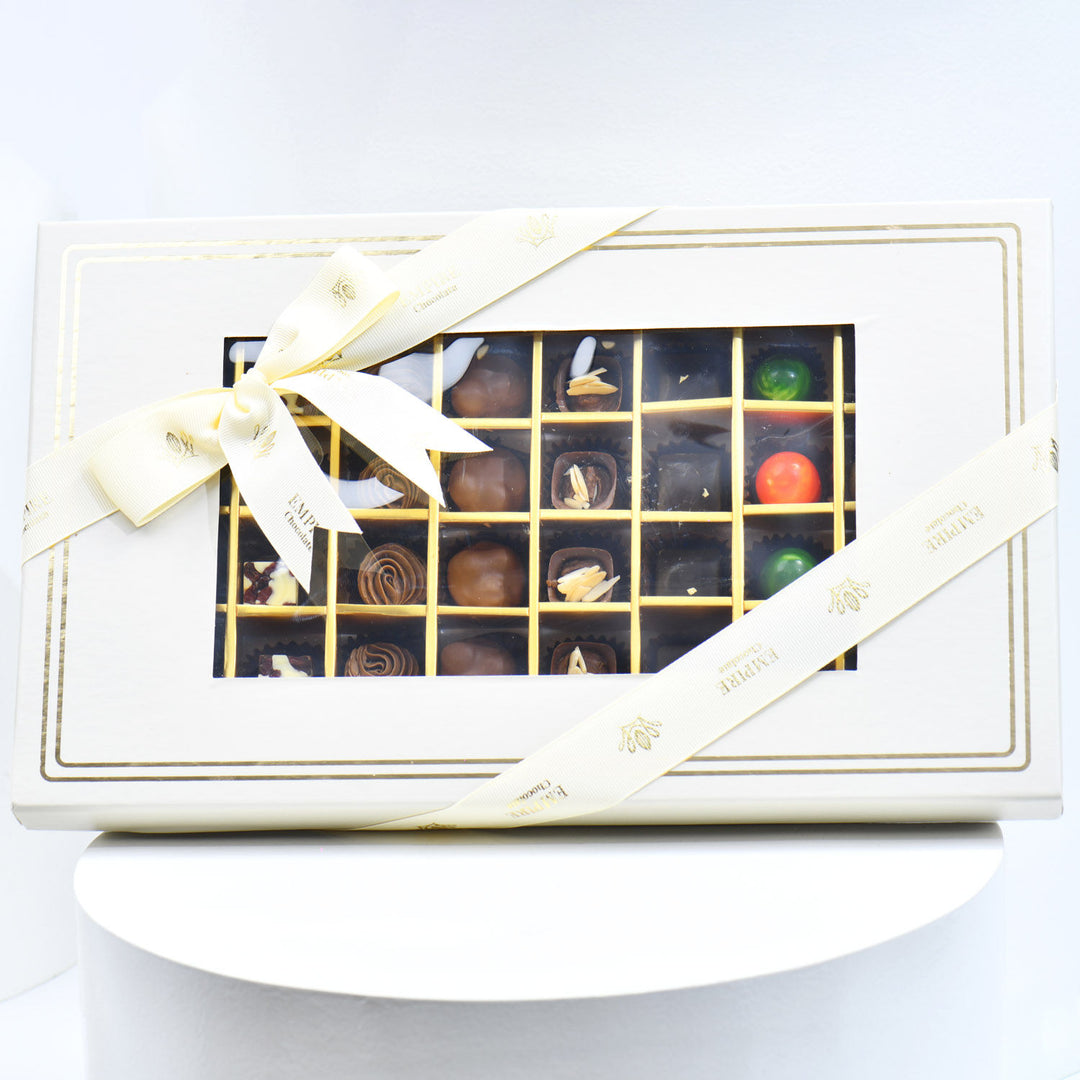 Luxurious Chocolate Box with 60 Assorted Belgian Pieces and Elegant Red Flower Arrangement