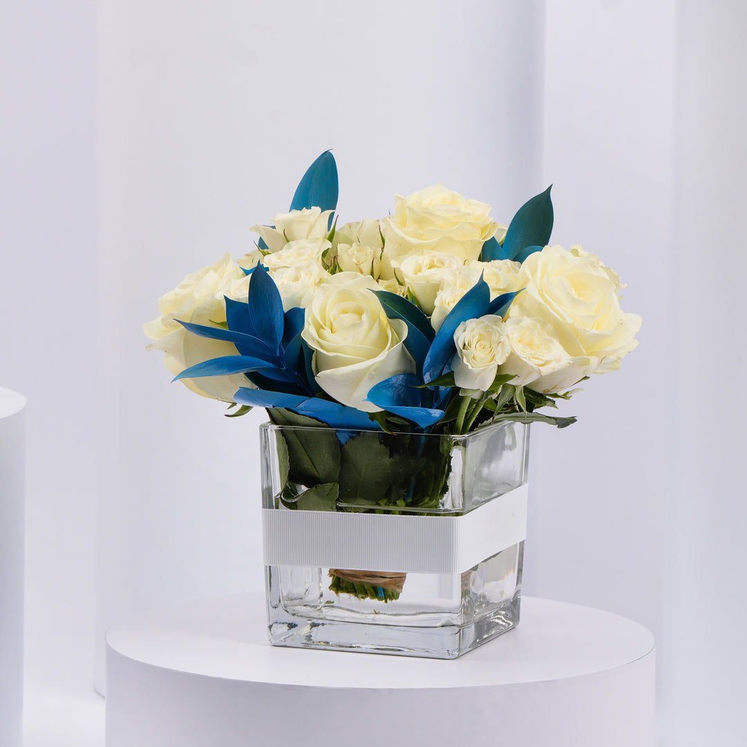 Elegant White Roses and Blue Ruscus Glass Vase Arrangement