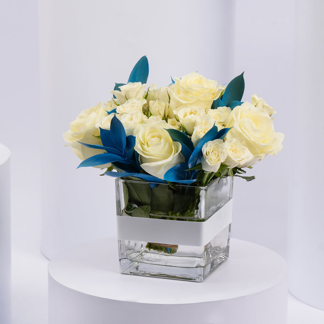 Elegant White Roses and Blue Ruscus Glass Vase Arrangement