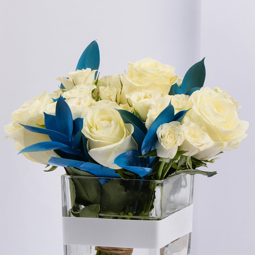 Elegant White Roses and Blue Ruscus Glass Vase Arrangement