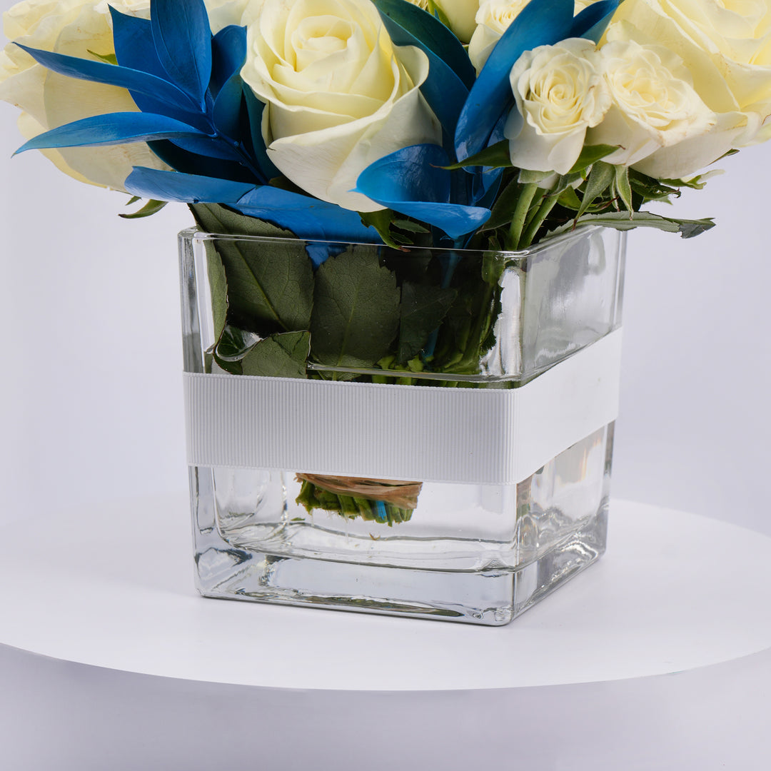 Elegant White Roses and Blue Ruscus Glass Vase Arrangement