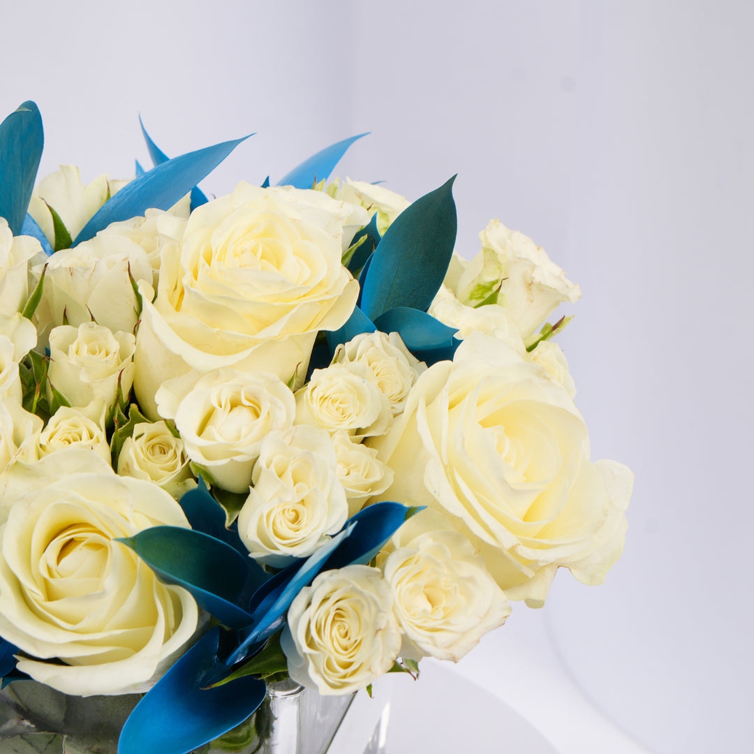 Elegant White Roses and Blue Ruscus Glass Vase Arrangement