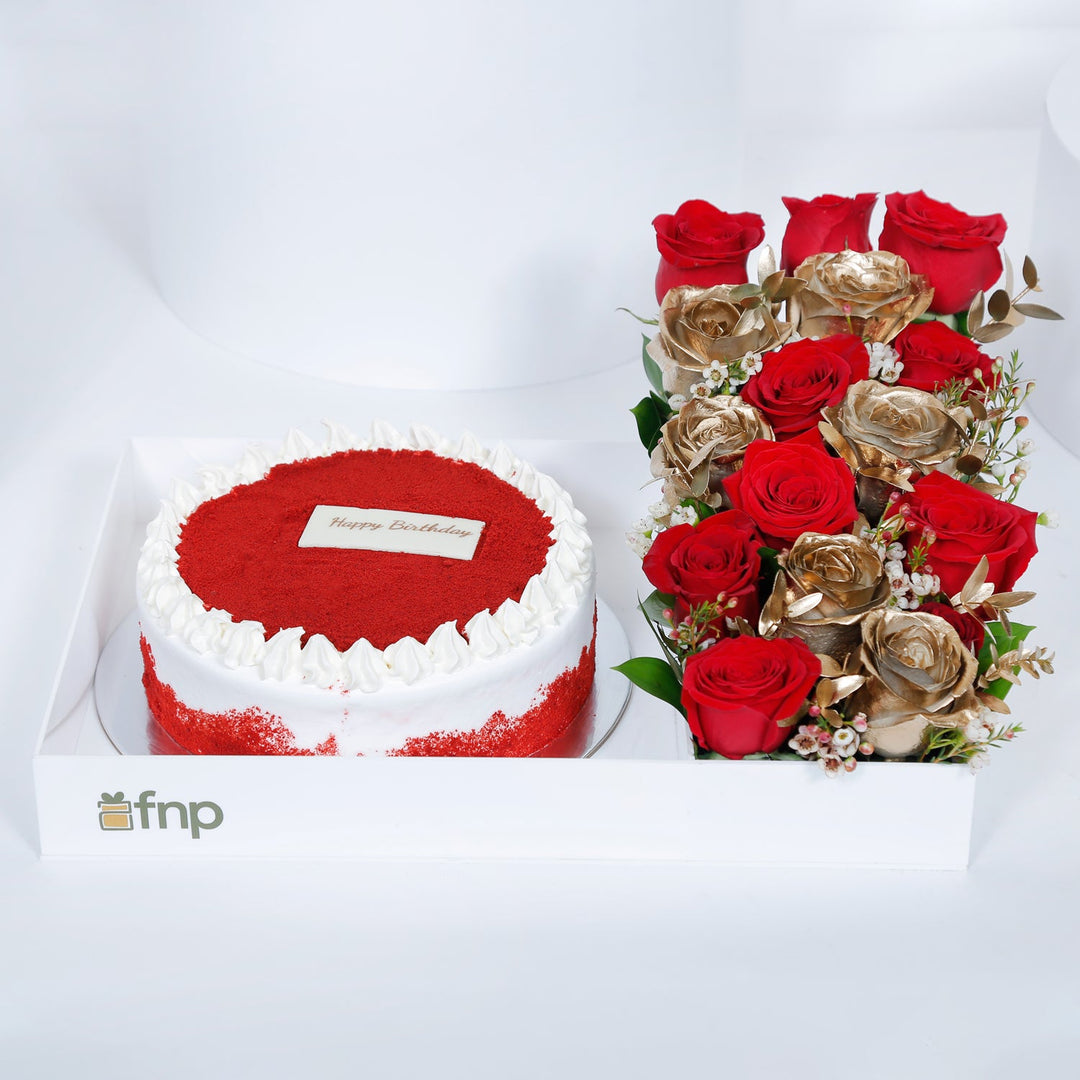Birthday Bliss: Luxurious Red Velvet Cake with Elegant Floral Arrangement