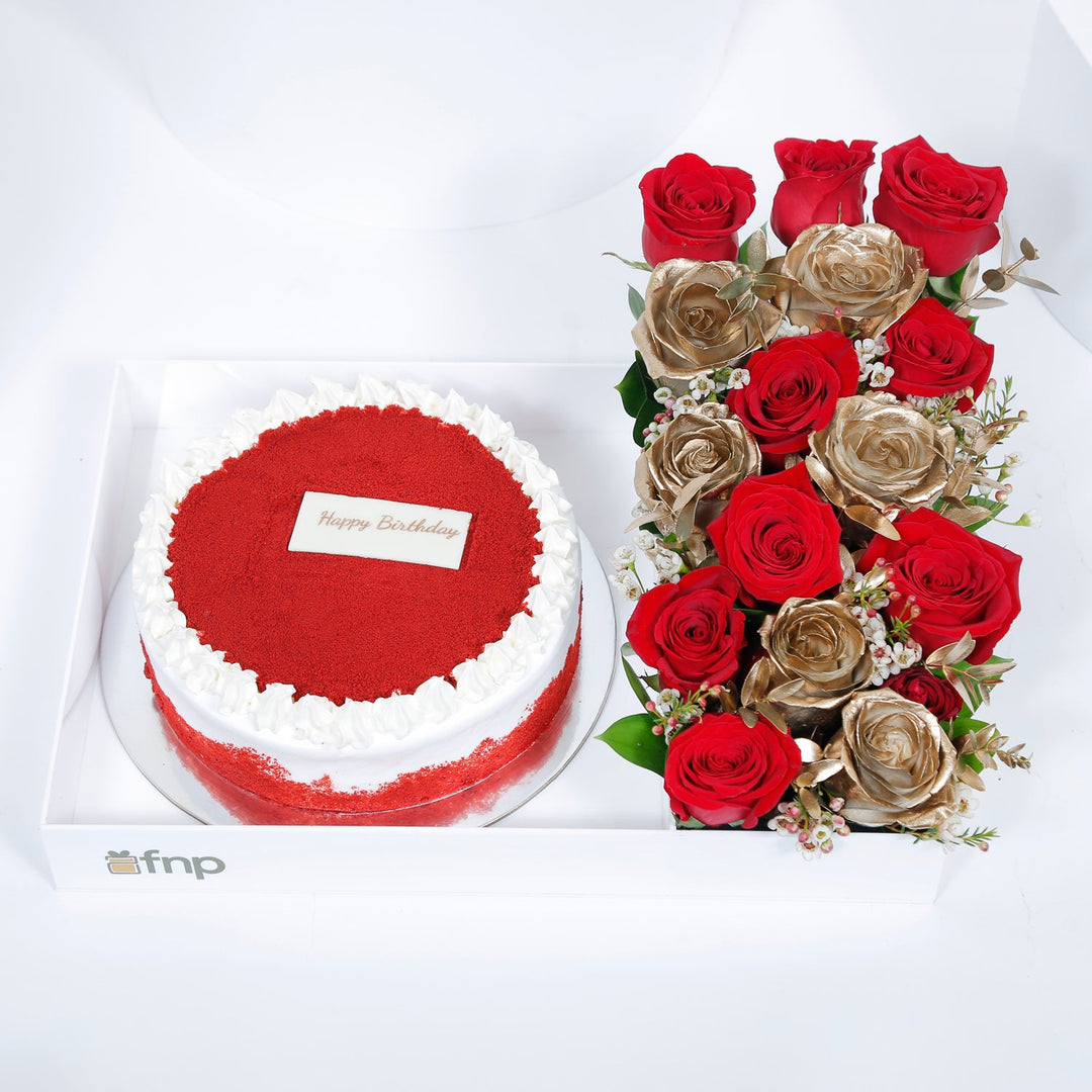 Birthday Bliss: Luxurious Red Velvet Cake with Elegant Floral Arrangement