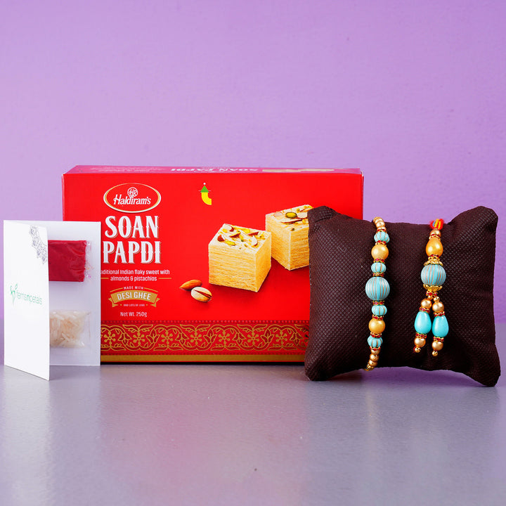 Blue Stone Rakhi Set And Soan Papdi Combo