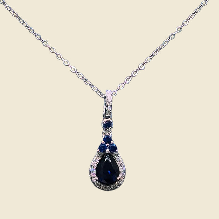 The Sapphire Glow Necklace with Elegant Yellow Rose Box