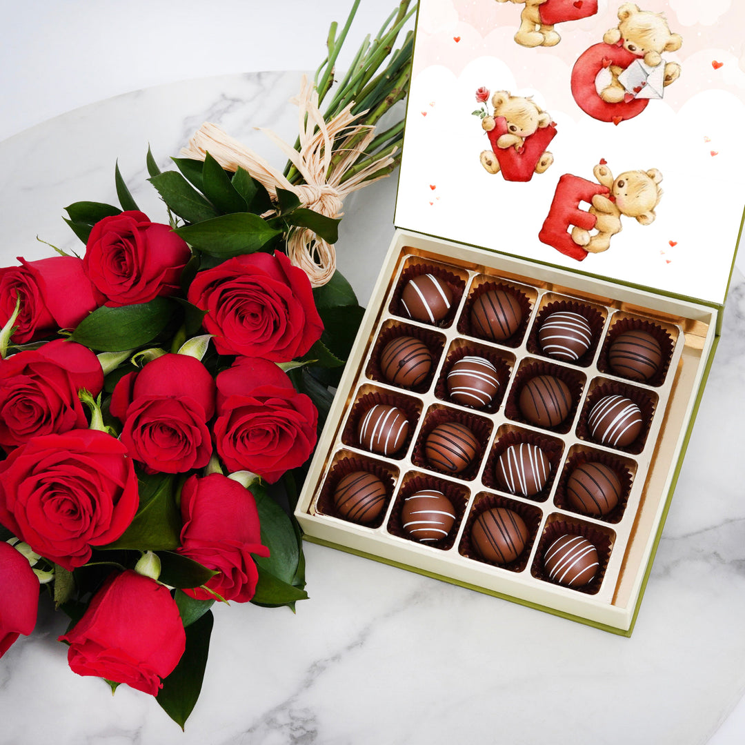 باقة ورود حمراء أنيقة ومجموعة هدايا شوكولاتة بلجيكية فاخرة