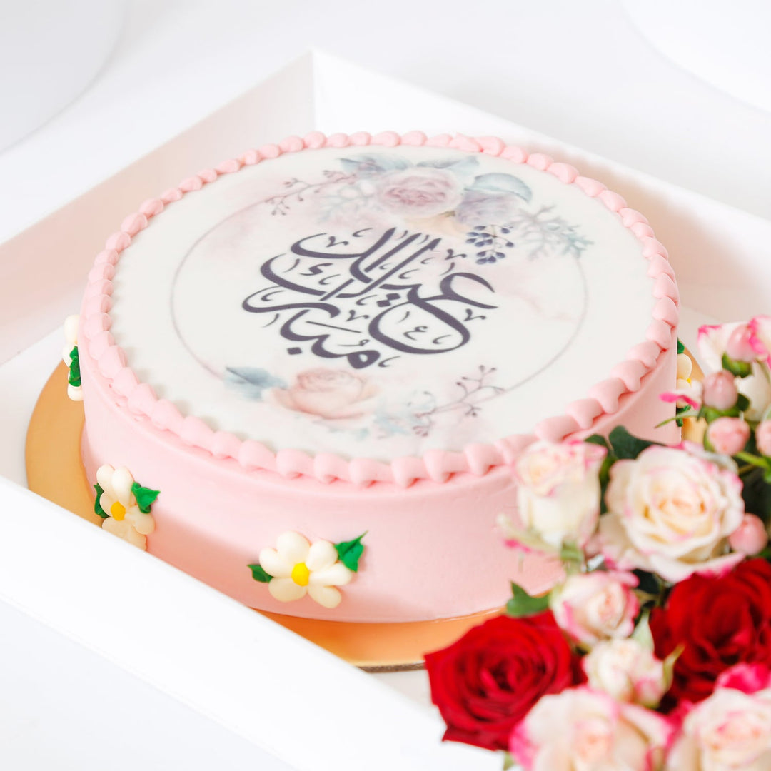 Elegant Pink Eid Mubarak Cake with Floral Arrangement in Acrylic Box