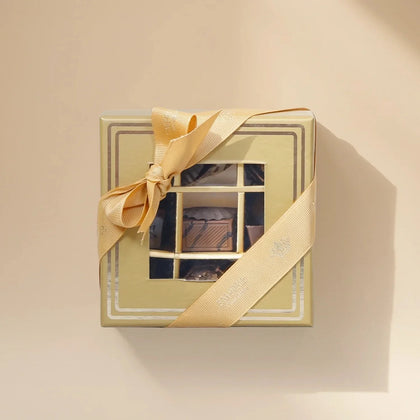 Empire Chocolate Gift Set | Luxurious Gold Chocolate Box with Assorted Delights & Vibrant Hand Bouquet