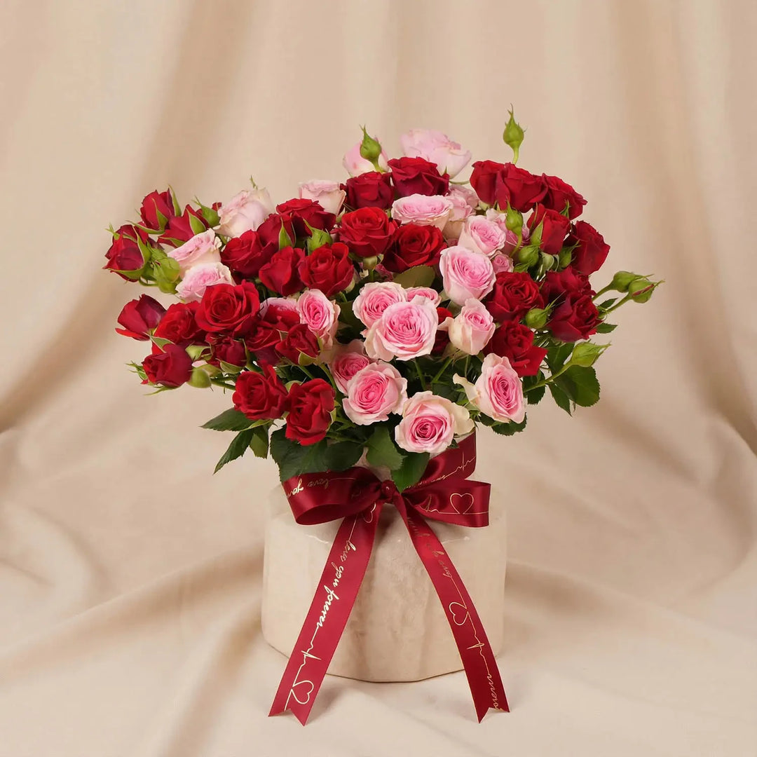 Endless Love Story: Elegant Red and Pink Spray Roses in Designer Vase